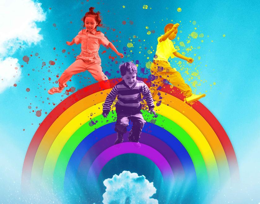 Children playing on a rainbow