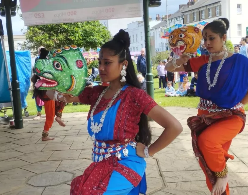 Classical Indian dancers with prop heads