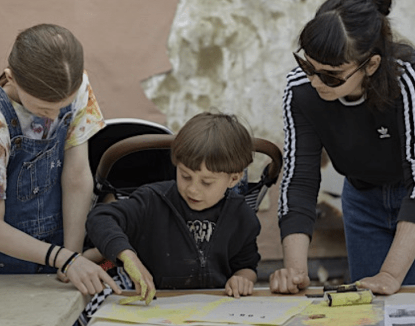 a family taking part in a printmaking activity