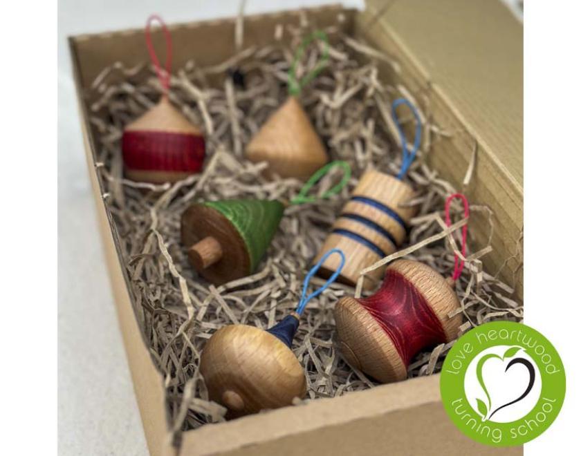 Set of six turned, wooden Christmas ornaments