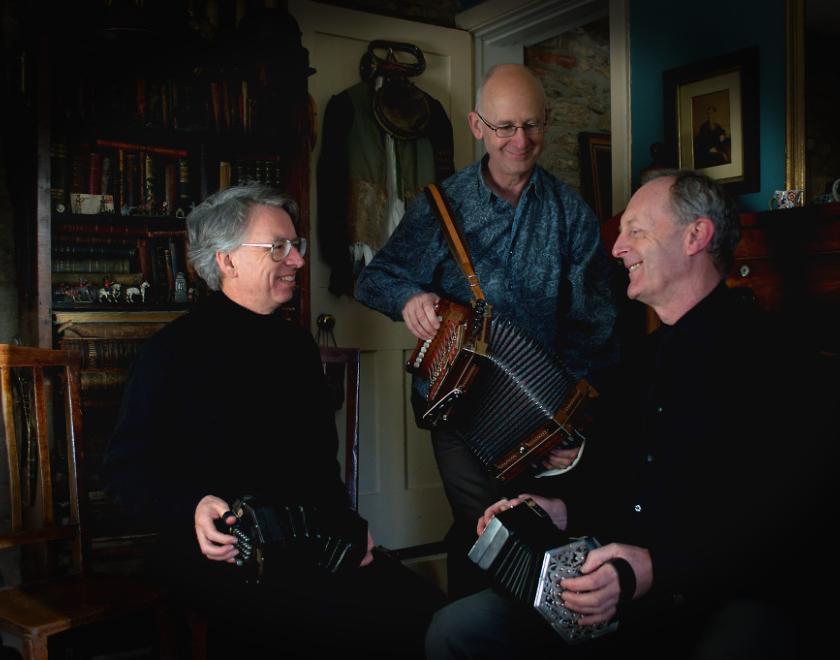 Photograph of the musicians, Three Pressed Men, with concertinas