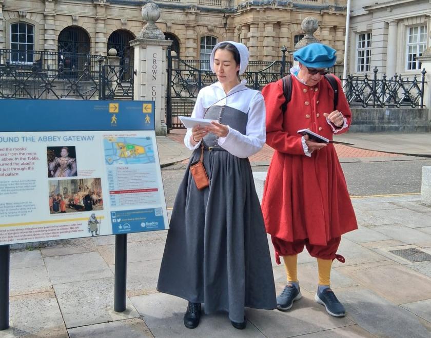2 people dressed in tudor costumes