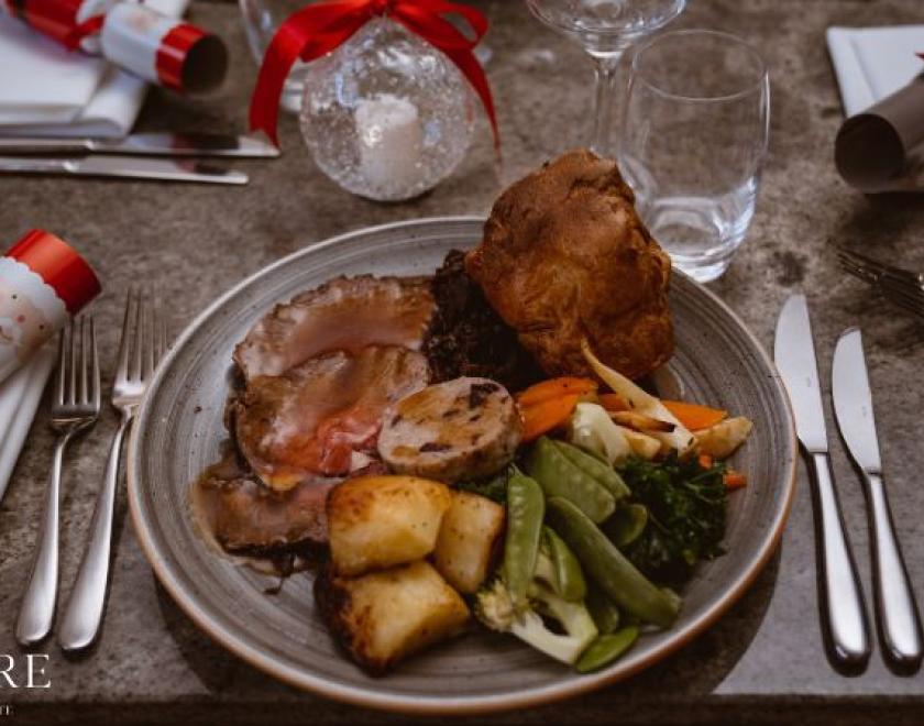 The image is of a festive carvery lunch 