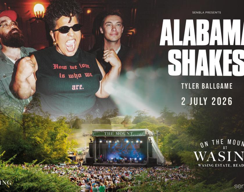 Poster with images of the band members floating above the Wasing stage