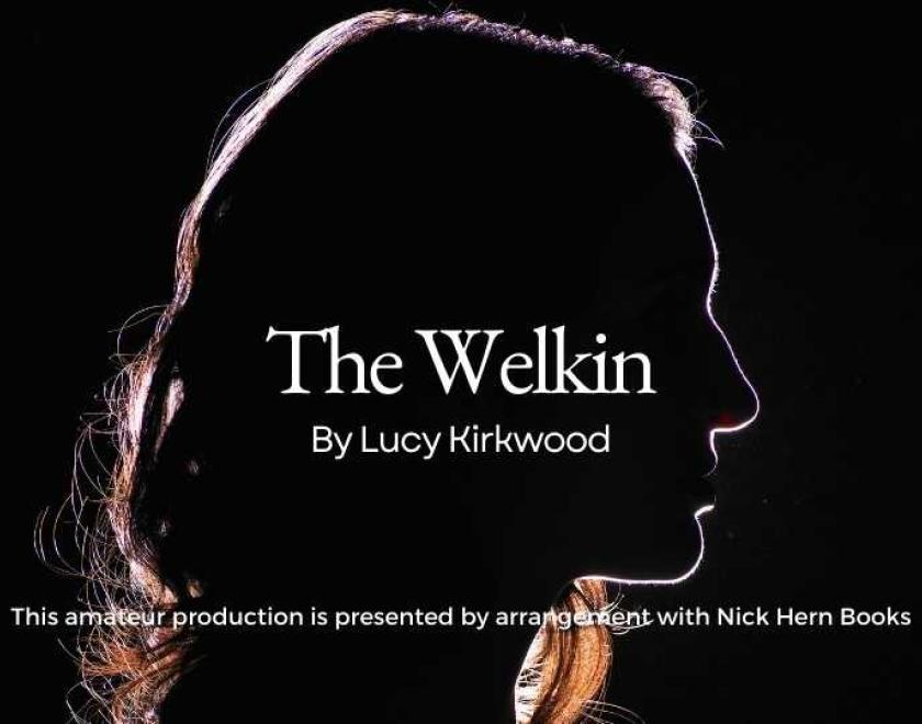 A woman in shadow looking to the right, with the words 'The Welkin by Lucy Kirkwood' over her face