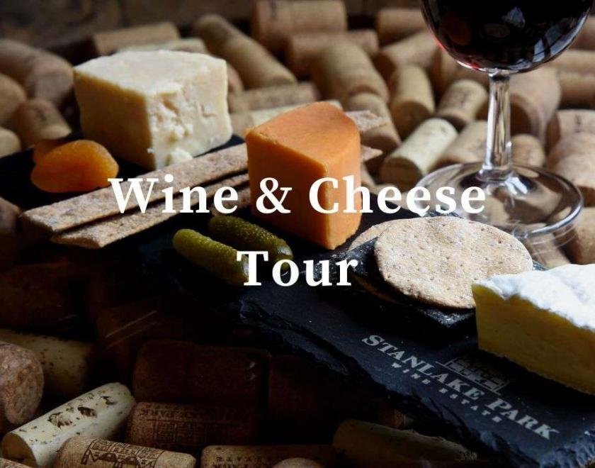 Wine and Cheese on a slate board, white text over the front saying Wine & Cheese tour