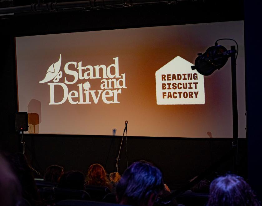 Picture of cinema screen with RBF and Stand and Deliver logo projected onto it