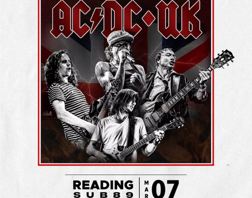 poster for AC/DC UK featuring band members in black and white against a red background