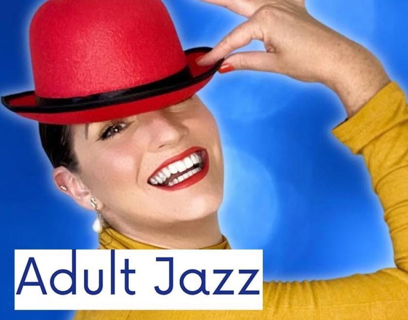 A woman posing with a red bowler hat