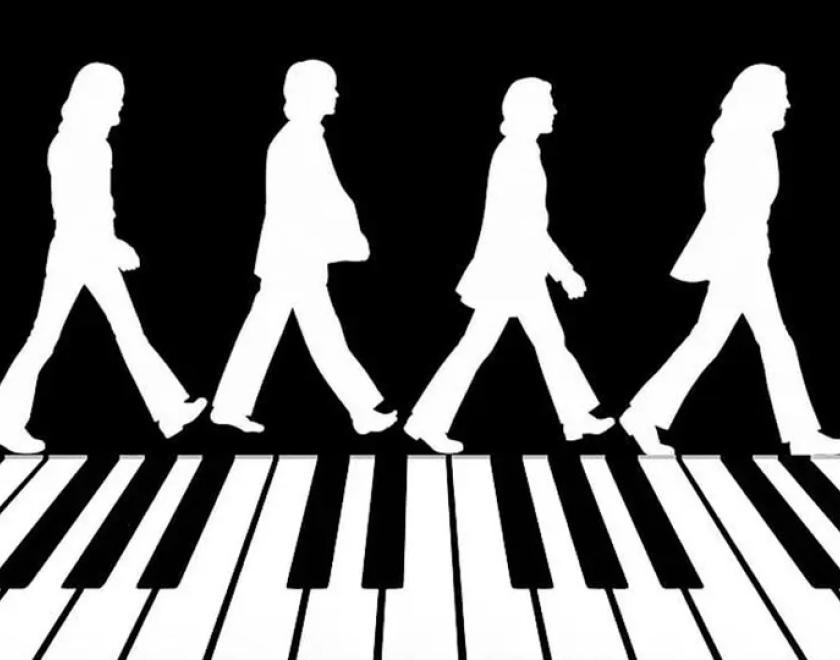Silhouettes of the Beatles crossing Abbey Road except the zebra crossing is a piano keyboard