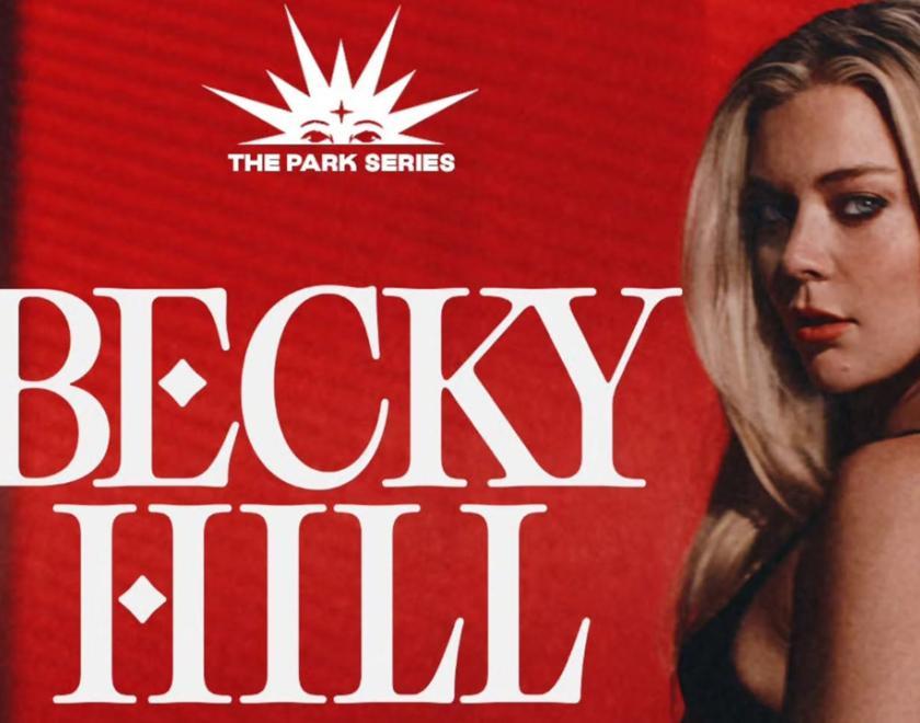 Photo of singer Becky Hill next to huge letters saying her name