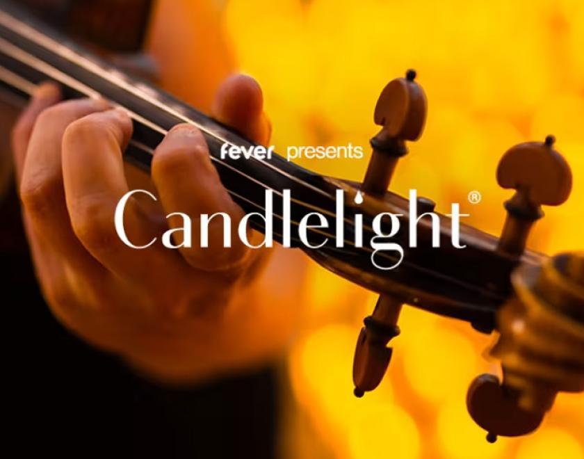 The words "fever presents Candlelight" over a close up image of a man playing a violin