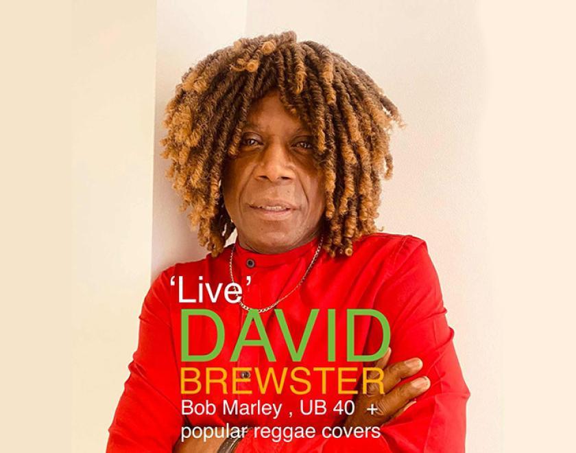 David Brewster wearing a red jumper