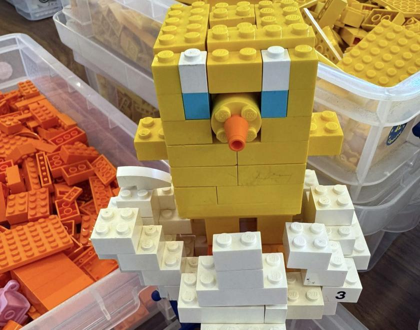 LEGO chick hatching from a LEGO shell