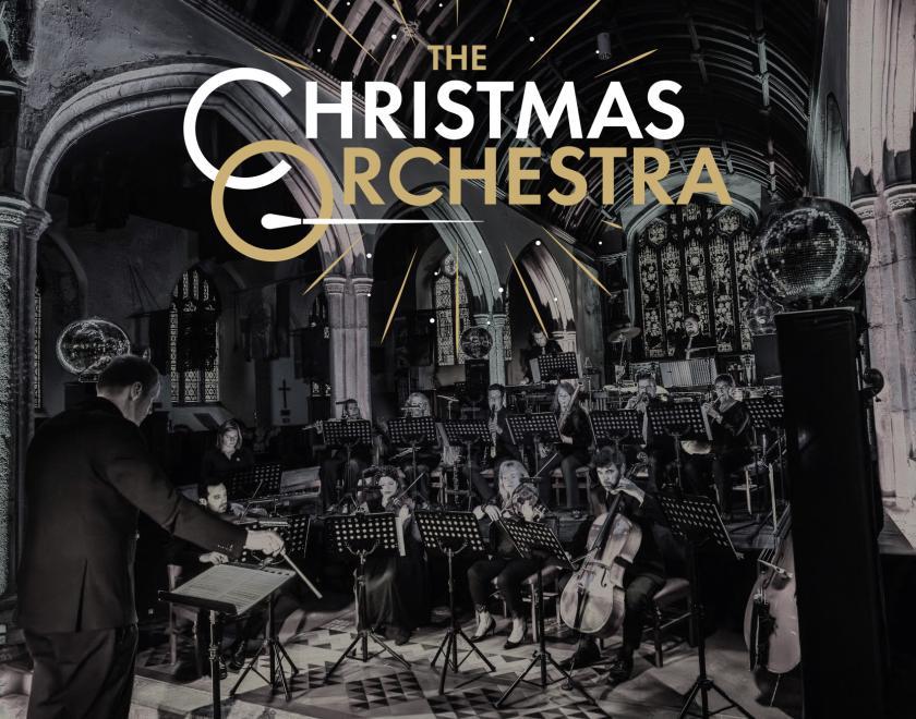 photo of a small chamber orchestra performing in a church