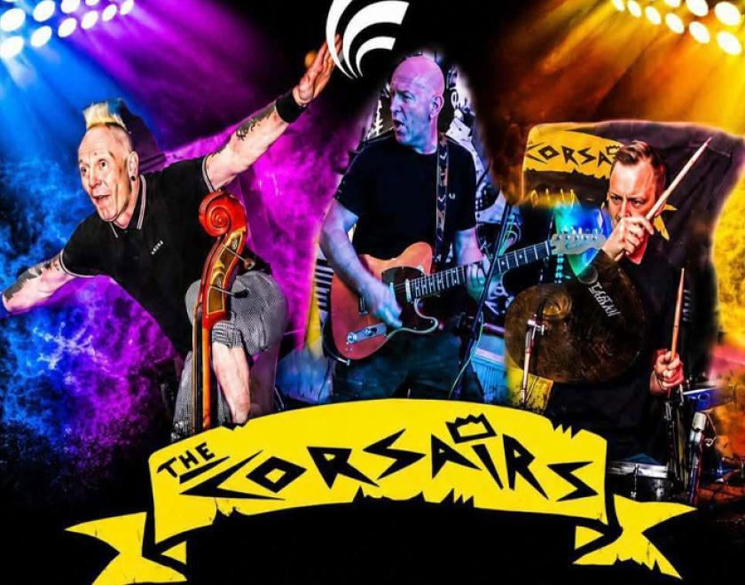 The rockabilly musicians playing bass, gutar and drums respectively, over the Corsairs band logo