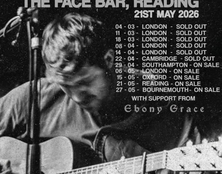 Poster with black and white photo of singer Dessie Magee holding a guitar