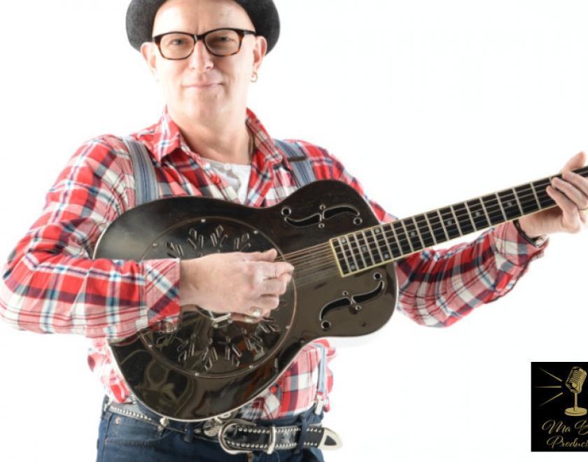 Singer Eddie Martin holding a steel guitar