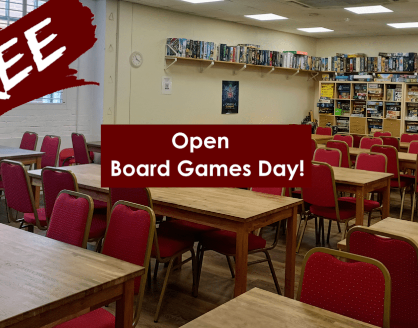 a banner showing a board games room with text talking about the open board games day