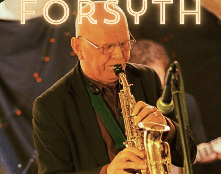 Alex Forsyth, a bald-headed man playing a saxophone