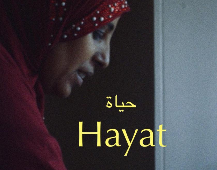 Film poster for Hayat with a Middle Eastern woman in traditional dress and the title of the film