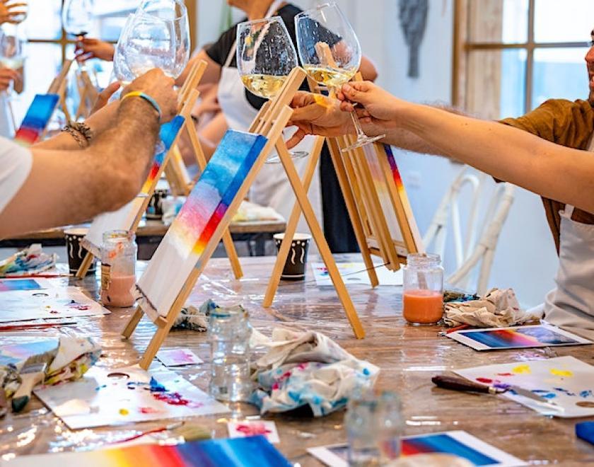 A group art class and cheers-ing glasses of prosecco