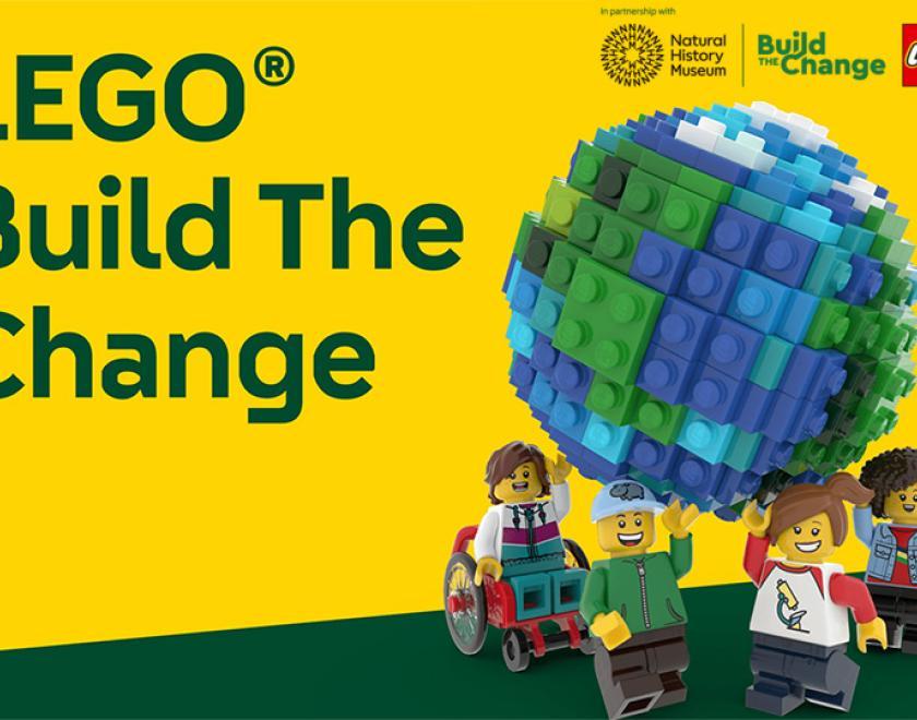 Lego figures holding a LEGO globe