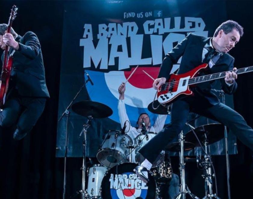 A Band Called Malice jumping on stage with Rickenbacker guitars