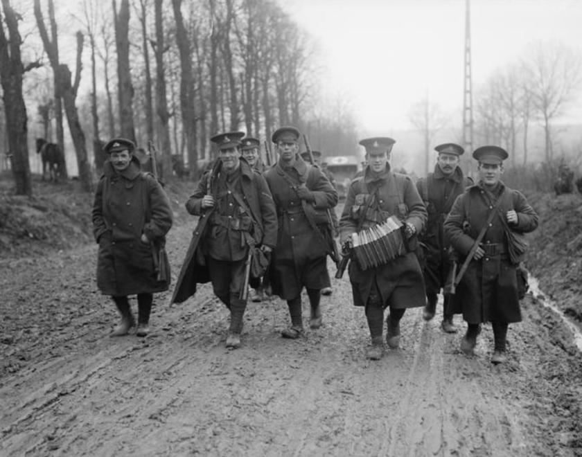 soldiers marching along road in the Somme area of France during World War One
