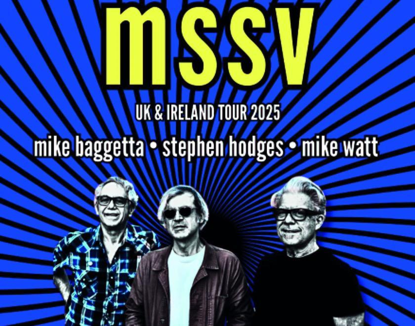 Three middle-aged men in glasses against a migraine-inducing blue and background