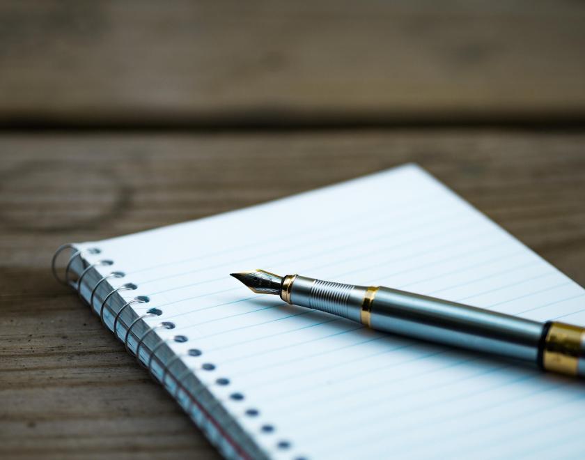 a pen and notebook