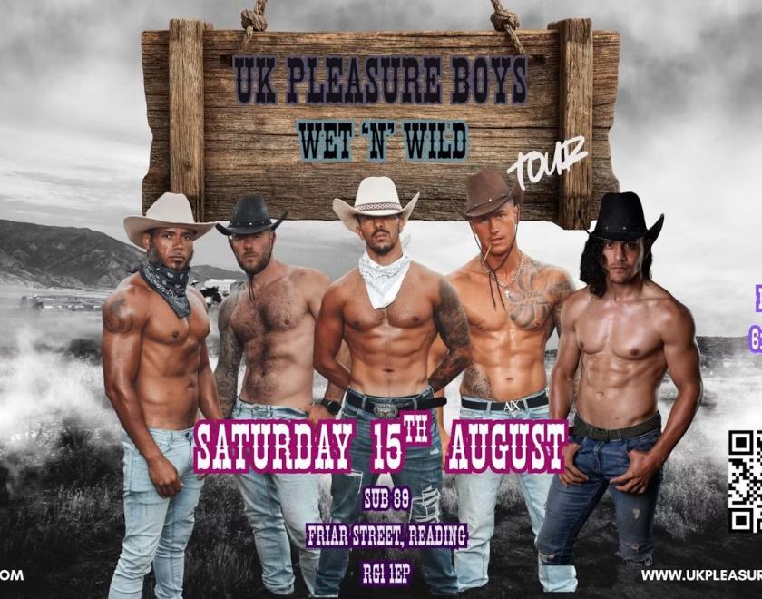 Muscular shirtless male dancers in cowboy hats