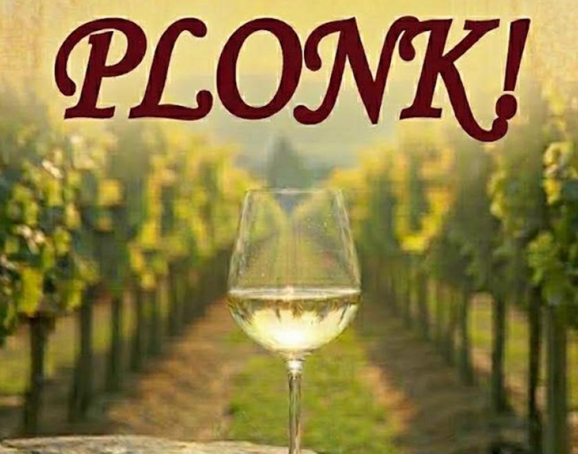 Poster with the title over a picture of a glass of wine in a vineyard