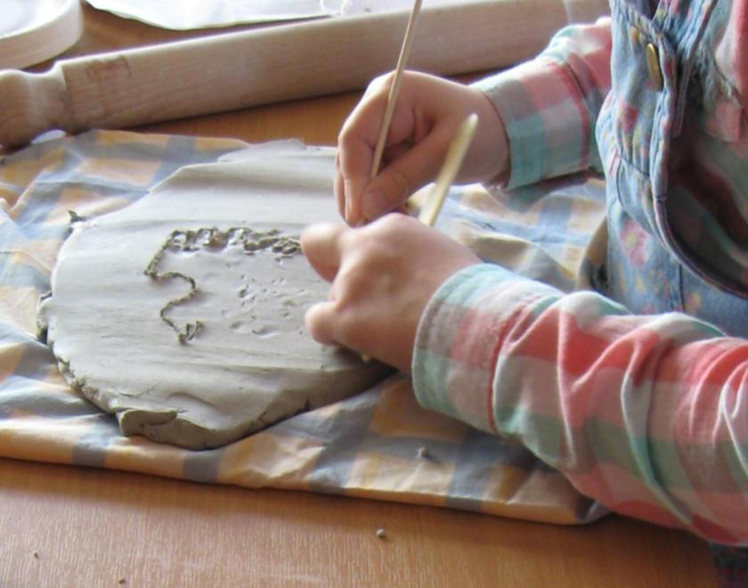 child modelling with clay