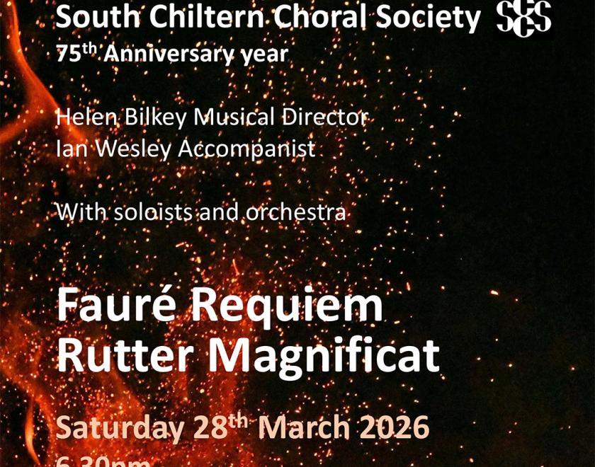 Cocnert poster with details of the event in front of an image of flames and sparks