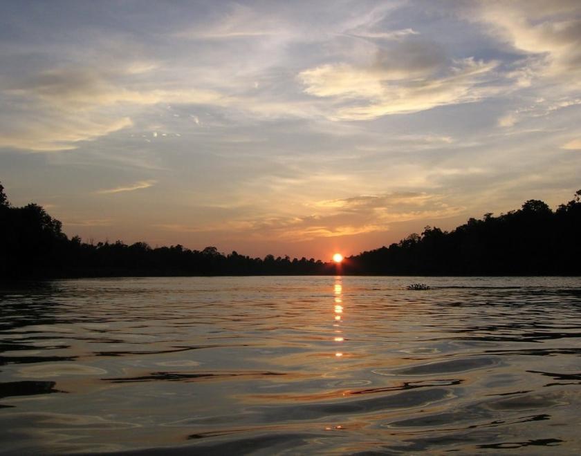 Photo of a river at sunset