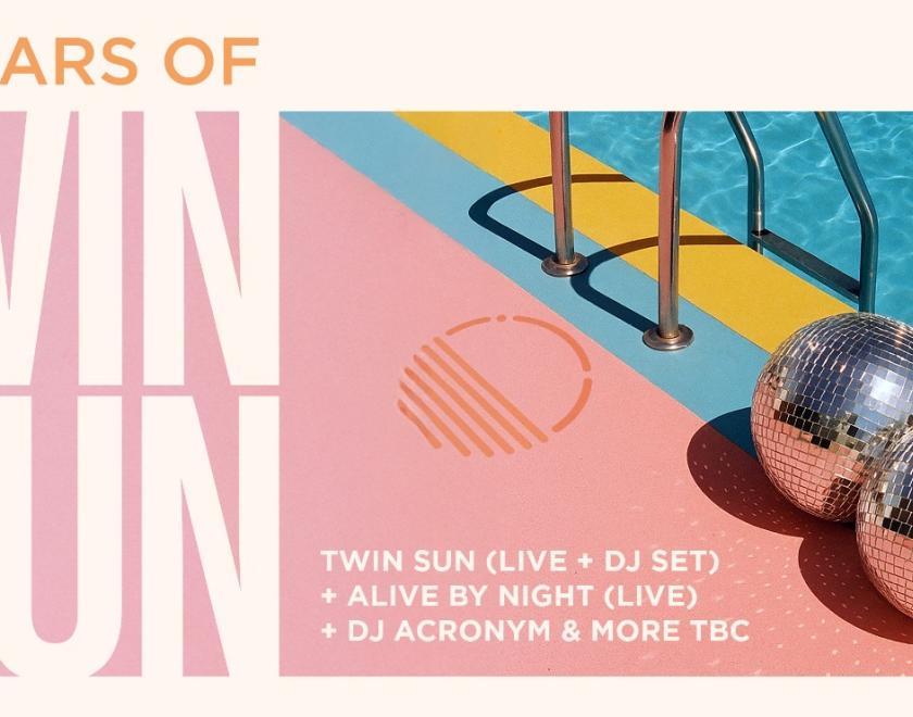 Disco balls by the side of a swimming pool