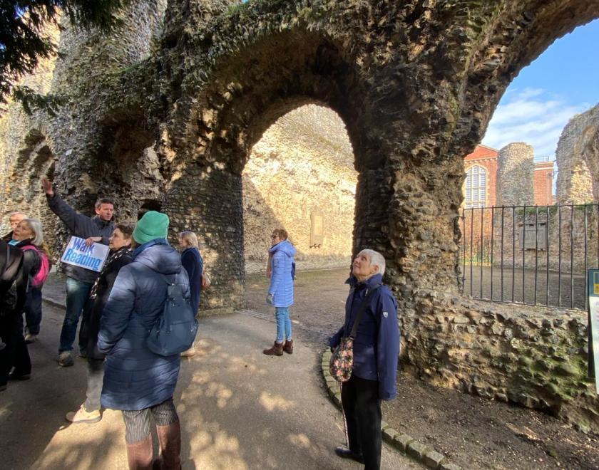 People being shown the ruins of Reading Abbey