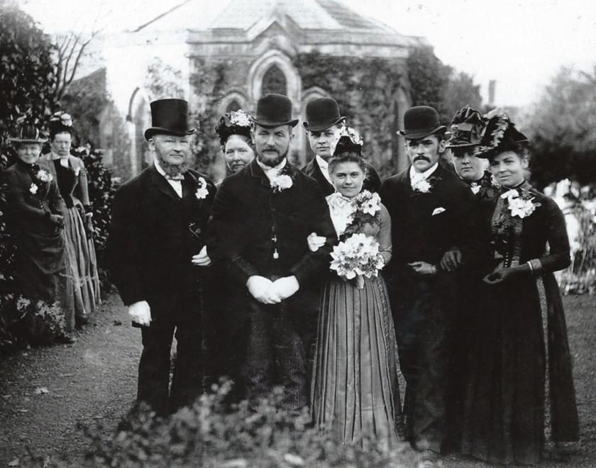 Victorian wedding photograph showing the wedding party in front of Sulham Church.