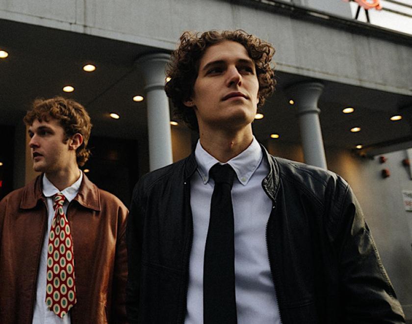 Two white men in jackets and ties