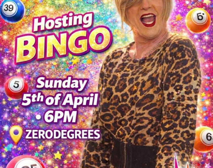 A drag queen and various bingo balls in the background