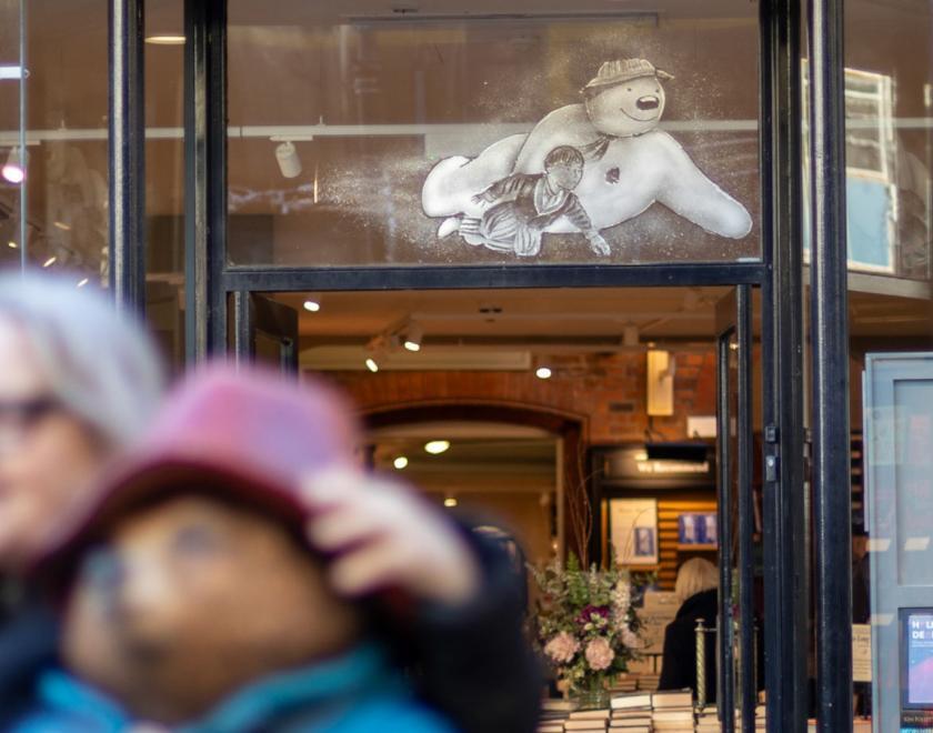 Shop window painted with a snow-effect Snowman (the Raymond Briggs version)